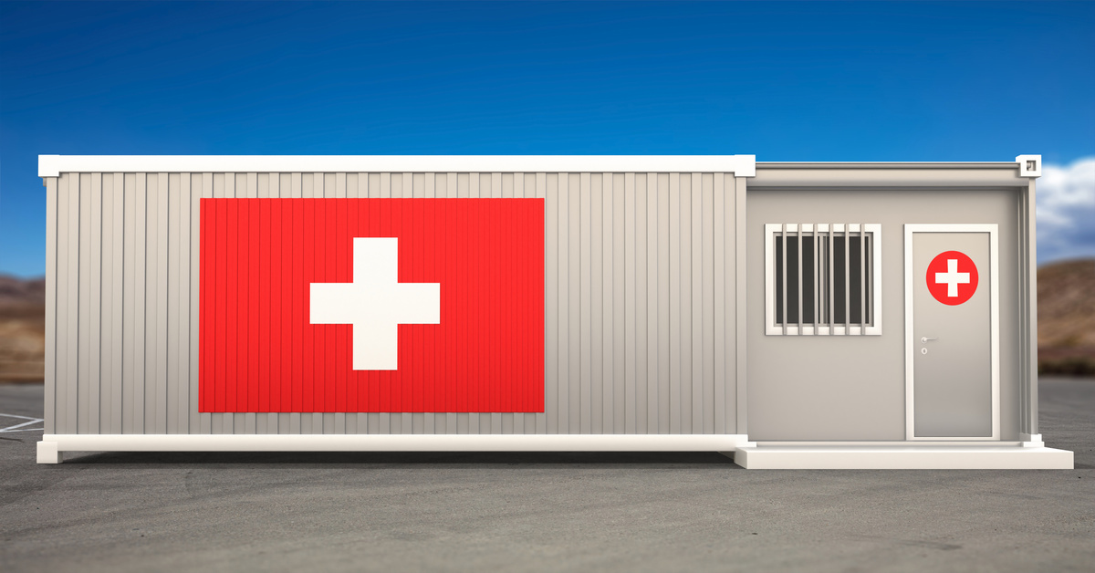 A digital illustration of a shipping container sitting outside on concrete with a red cross symbol on the front of it.